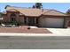 Charming single-story home with a well-maintained front yard and two-car garage at 8901 Kingsmill Dr, Las Vegas, NV 89134