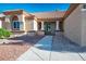 Single story home featuring desert landscaping and inviting front entry with decorative columns at 8901 Kingsmill Dr, Las Vegas, NV 89134
