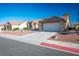 Inviting single story home featuring desert landscaping, tile roof, and a two car garage at 8901 Kingsmill Dr, Las Vegas, NV 89134