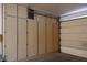 Garage featuring built-in storage cabinets and access to the garage door at 8901 Kingsmill Dr, Las Vegas, NV 89134