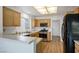 Kitchen with wood cabinets, stainless steel appliances, and breakfast bar at 8901 Kingsmill Dr, Las Vegas, NV 89134