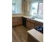 Bright kitchen featuring wood cabinets, a stainless steel sink, and modern appliances at 8901 Kingsmill Dr, Las Vegas, NV 89134