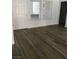 Living room showcasing wood laminate floors, natural light from windows, and neutral paint at 8901 Kingsmill Dr, Las Vegas, NV 89134