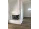 Inviting living room with a white brick fireplace and view of the chandelier at 8901 Kingsmill Dr, Las Vegas, NV 89134