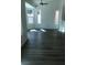 Bright living space with a ceiling fan and views of the backyard through large windows at 8901 Kingsmill Dr, Las Vegas, NV 89134