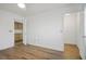 Spacious main bedroom with wood floors, ceiling fan, and closet at 8901 Kingsmill Dr, Las Vegas, NV 89134