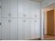 Pantry featuring white cabinets with silver hardware, providing ample storage space at 8901 Kingsmill Dr, Las Vegas, NV 89134