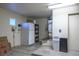 Storage room with a refrigerator, shelving, and a hot water heater at 8901 Kingsmill Dr, Las Vegas, NV 89134
