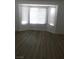 Bright sunroom with a bay window and hardwood flooring at 8901 Kingsmill Dr, Las Vegas, NV 89134