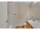 Bright bathroom featuring a tub shower, toilet, and a vanity with sink at 8940 Emery Lake St, Las Vegas, NV 89123