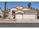 Charming single-story home featuring a two-car garage and low-maintenance desert landscaping at 8940 Emery Lake St, Las Vegas, NV 89123