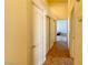 Hallway featuring tile floors, neutral walls, and access to multiple rooms at 8940 Emery Lake St, Las Vegas, NV 89123