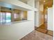 Open-concept living area with a view of the kitchen and access to the backyard at 8940 Emery Lake St, Las Vegas, NV 89123