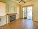 Cozy living room with a fireplace and a sliding glass door to the backyard at 8940 Emery Lake St, Las Vegas, NV 89123