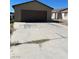 Single story home with a two car garage and concrete driveway at , Las Vegas, NV 89106
