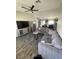 View of the living room with a gray sectional sofa and a TV at , Las Vegas, NV 89106