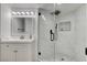 Modern bathroom with marble-tiled walk-in shower, sleek fixtures, and stylish vanity at , Las Vegas, NV 89146