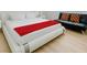 Bright, clean bedroom with a modern bed, futon, and wood-look flooring at , Las Vegas, NV 89146