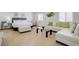 Comfortable bedroom with a cozy seating area, natural light, and a queen size bed at , Las Vegas, NV 89146