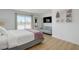 Bright bedroom featuring a seating area, large window with views, and a queen-size bed with soft, neutral bedding at , Las Vegas, NV 89146