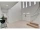 Grand foyer with staircase, and a view into an adjacent living area at , Las Vegas, NV 89146
