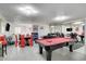 Spacious game room with pool table, seating area, and mirrored wall, ideal for entertainment and relaxation at , Las Vegas, NV 89146