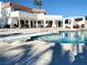 Inviting pool area with diving board, ideal for relaxation and recreation with an adjacent covered seating area at , Las Vegas, NV 89146