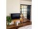 Bedroom showcasing a dark sliding grid-style closet door, rattan shelving, and a modern interior design at 10403 Fancy Fern St, Las Vegas, NV 89183