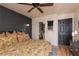 Spacious bedroom featuring a statement wall, soft bedding, and ample natural light at 10403 Fancy Fern St, Las Vegas, NV 89183
