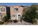 Charming two-story home with a landscaped front yard and cozy patio at 10403 Fancy Fern St, Las Vegas, NV 89183