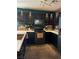 Modern kitchen featuring sleek black cabinets, updated appliances, and ample counter space at 10403 Fancy Fern St, Las Vegas, NV 89183