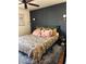 Comfortable main bedroom with dark accent wall, stylish lighting, and area rug at 10403 Fancy Fern St, Las Vegas, NV 89183