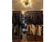Spacious walk-in closet featuring custom shelves, rods, and drawers for optimal storage and organization at 10403 Fancy Fern St, Las Vegas, NV 89183