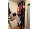 Organized walk-in closet with hanging clothes, shelves and storage baskets at 10403 Fancy Fern St, Las Vegas, NV 89183