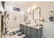 Elegant bathroom features double sinks, framed mirrors, and a glass-enclosed shower at 10408 Mezzanino Ct, Las Vegas, NV 89135