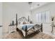 This bedroom offers relaxation with a queen bed, natural light, and bedside tables, for a peaceful retreat at 10408 Mezzanino Ct, Las Vegas, NV 89135