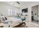 This bedroom offers serene retreat with plantation shutters, a comfortable bed, and stylish dresser for relaxed living at 10408 Mezzanino Ct, Las Vegas, NV 89135