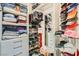 Well-organized closet featuring shelves and drawers for folded clothing, shoes, and accessories to keep your wardrobe tidy at 10408 Mezzanino Ct, Las Vegas, NV 89135