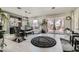 Open dining room featuring a long wood table, bench seating and patio view at 10408 Mezzanino Ct, Las Vegas, NV 89135