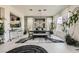 Elegant dining room with modern chandelier, dining table with seating, and views to the kitchen at 10408 Mezzanino Ct, Las Vegas, NV 89135