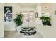 Bright entryway featuring wood floors, a stylish rug, and tasteful decor at 10408 Mezzanino Ct, Las Vegas, NV 89135