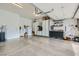 Spacious garage with epoxy flooring, storage cabinets, and a work area at 10408 Mezzanino Ct, Las Vegas, NV 89135