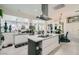 Open kitchen with an island, stainless steel appliances, and easy access to the dining and living areas at 10408 Mezzanino Ct, Las Vegas, NV 89135