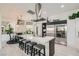Bright kitchen featuring an island with seating, stainless steel appliances, and modern cabinetry at 10408 Mezzanino Ct, Las Vegas, NV 89135