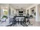 Open living room features a modern entertainment center and an exercise bike, perfect for a healthy lifestyle at 10408 Mezzanino Ct, Las Vegas, NV 89135