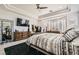 Comfortable main bedroom with a ceiling fan, accent wall, and lots of natural light at 10408 Mezzanino Ct, Las Vegas, NV 89135