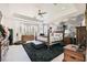Spacious main bedroom features tray ceilings, a ceiling fan, and a decorative accent wall at 10408 Mezzanino Ct, Las Vegas, NV 89135