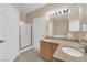 Well-lit bathroom with double sink vanity and framed glass shower at 10550 W Alexander Rd # 2233, Las Vegas, NV 89129