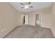 Bedroom with neutral colored walls and carpet with a ceiling fan at 10550 W Alexander Rd # 2233, Las Vegas, NV 89129