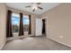 Bedroom with neutral walls, carpet and windows with dark drapes at 10550 W Alexander Rd # 2233, Las Vegas, NV 89129
